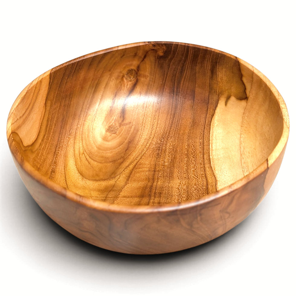 Angled view of a hand-finished teak serving bowl with natural grain