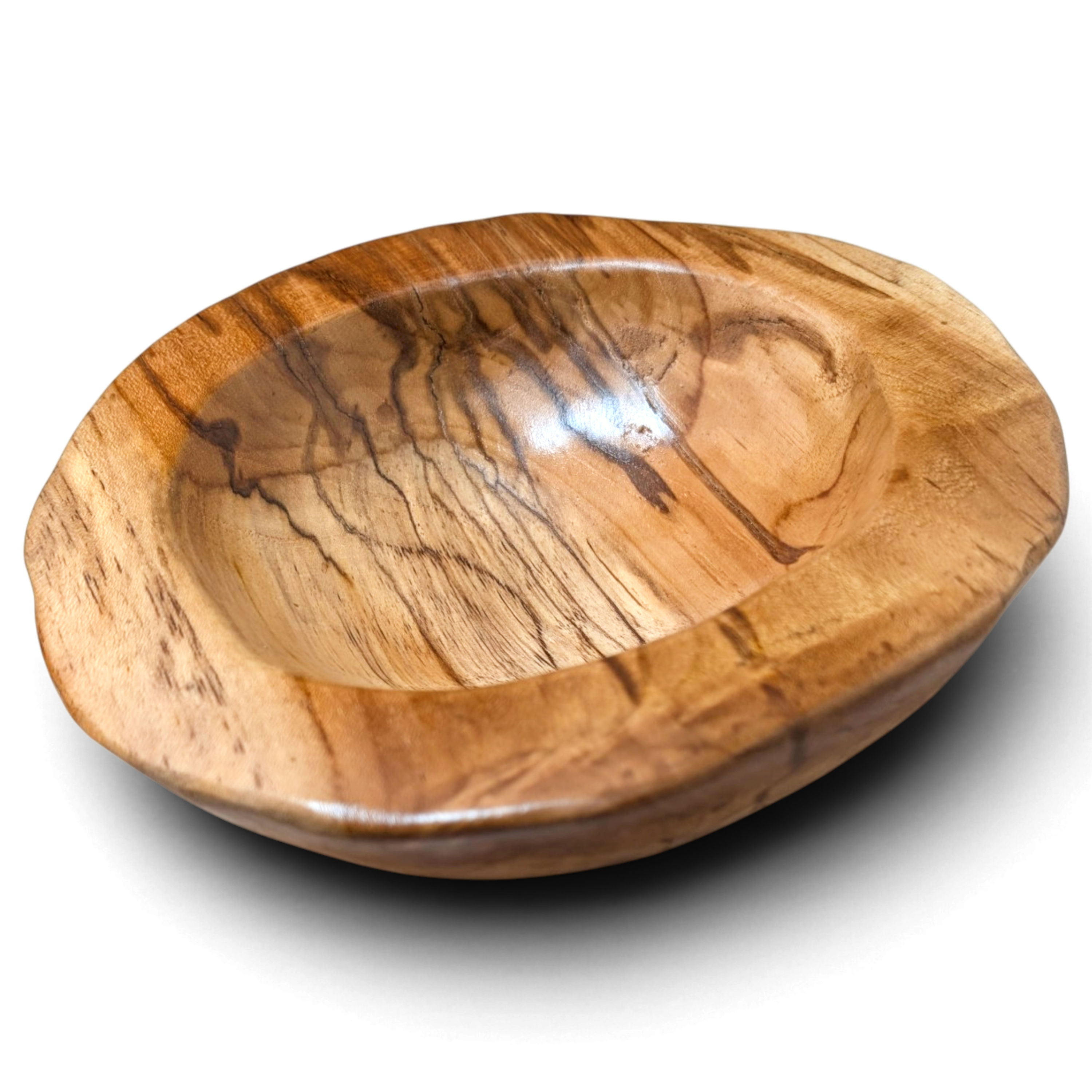 Angled irregular teak fruit bowl with a substantial carved border