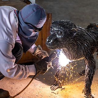 Making monkey scrap metal sculpture