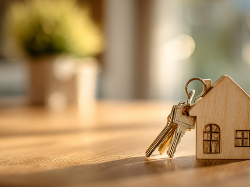 House keys beside a small wooden home model, illustrating California Proposition 37 and proposed down payment loans for qualifying homebuyers.