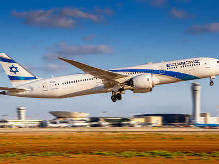 EL AL Boeing 787 Dreamliner taking off above an airport runway, bearing the airline’s blue-and-white livery and Israeli flag on its tail.