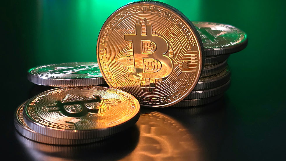 Golden Bitcoin coins stacked on a reflective black surface, green light in background, creating a futuristic and digital mood.