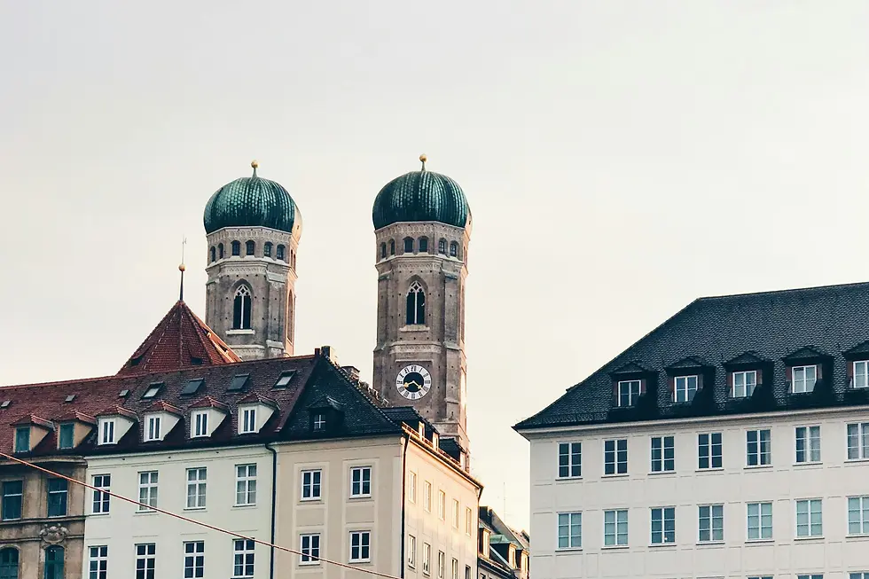 Twin-domed church towers rising above historic white buildings, private jet catering at Ingolstadt-Manching Airport (IGS / ETSI), Manching, Germany