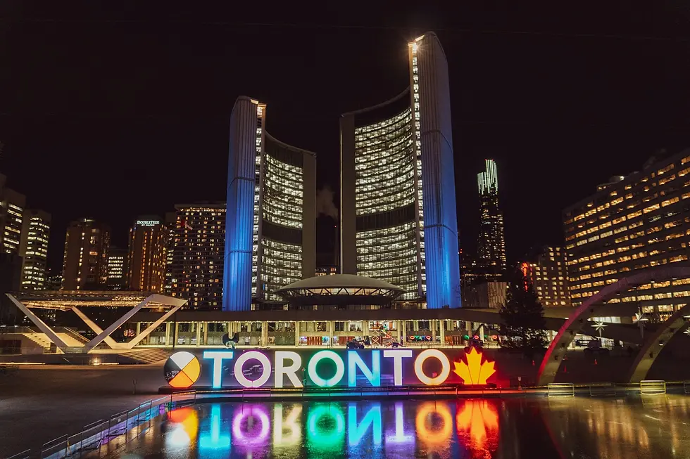 City hall towers and a colorful illuminated city sign at night, private jet catering at Chapais Airport (YMT / CYMT), Chibougamau, Canada