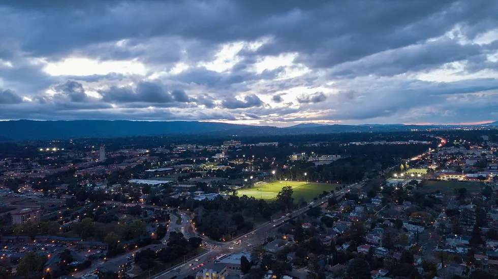 Wide suburban valley with a green field under heavy storm clouds, private jet catering at Palo Alto Airport (PAO / KPAO), Palo Alto, United States