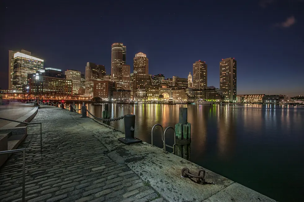Harbor skyline at night seen from a stone pier, private jet catering at Martha's Vineyard Airport (MVY / KMVY), Martha's Vineyard, United States