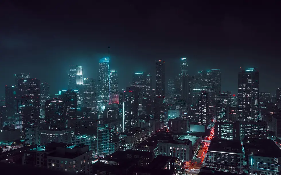 Moody teal night skyline of high-rise towers and city streets, private jet catering at Hollywood Burbank Airport (BUR / KBUR), Burbank, United States