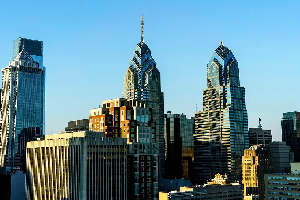 Twin glass skyscrapers with pointed crowns against a clear blue sky, private jet catering at Wilmington Airport (ILG / KILG), Wilmington, United States