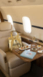 Luxury private jet catering setup inside executive aircraft cabin