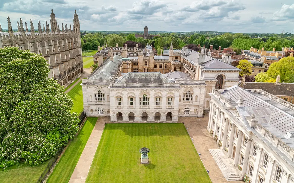 Aerial view of historic collegiate stone buildings around a manicured green lawn, private jet catering at Cambridge Airport (CBG / EGSC), Cambridge, Cambridgeshire, United Kingdom