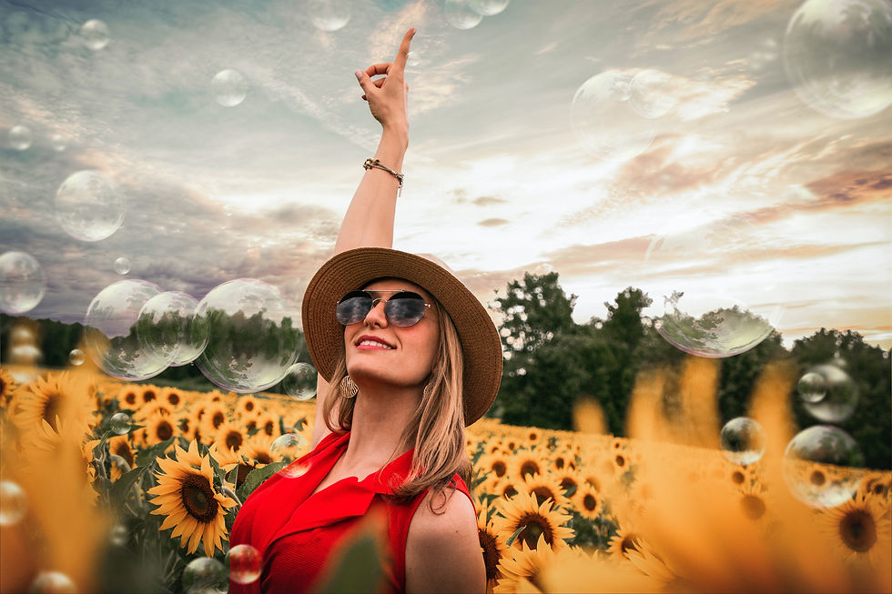 lady wearing red and sunglasses in a sunflower field