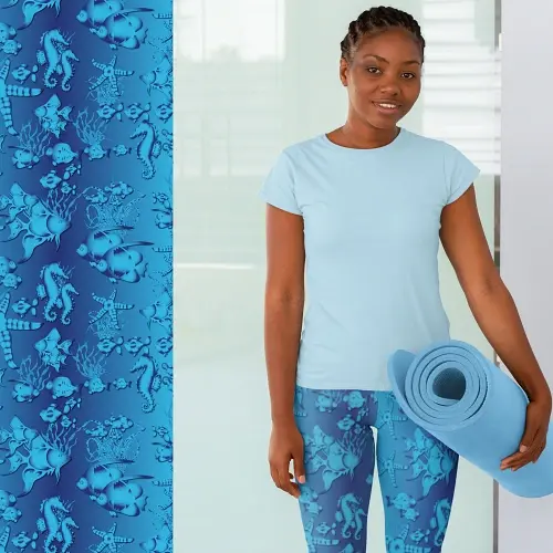 Thumbnail: Woman in capri leggings with marine life pattern in shades of blue