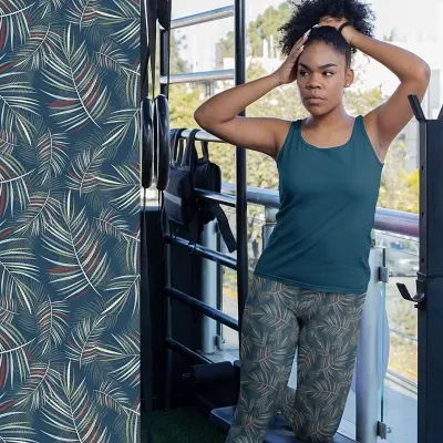 Thumbnail: Girl in Youth 8-20 leggings wearing Arapawa blue fern floral leggings