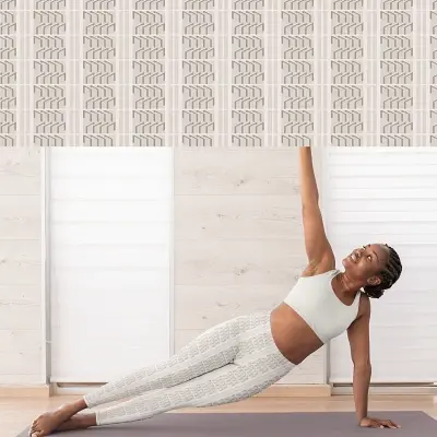 Thumbnail: Teenager wearing Ascent Art Deco Pattern leggings while stretching.