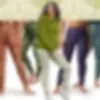 Group of diverse women wearing the same olive geometric print leggings