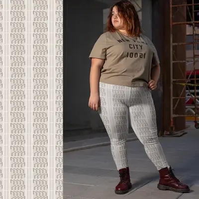 Thumbnail: Plus-size woman in Ascent Art Deco leggings standing