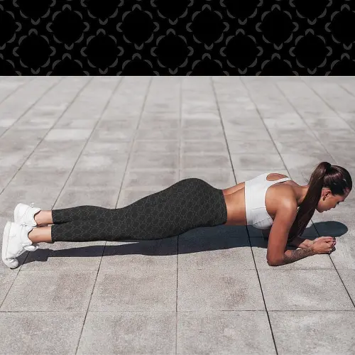 Thumbnail: Model in Paradox Floral leggings with pockets and black base planking