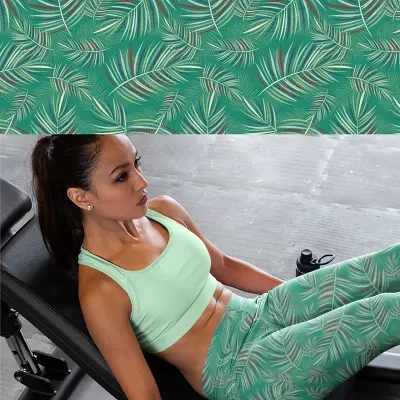 Thumbnail: Woman in 2XS-6XL leggings with pockets wearing Elf green fern floral leggings