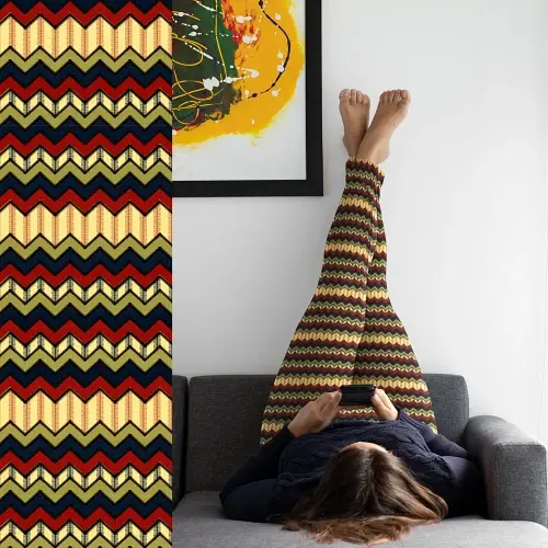 Thumbnail: A woman wearing Aztec Canvas Zigzag Pattern Leggings in adult size, paired with a black top