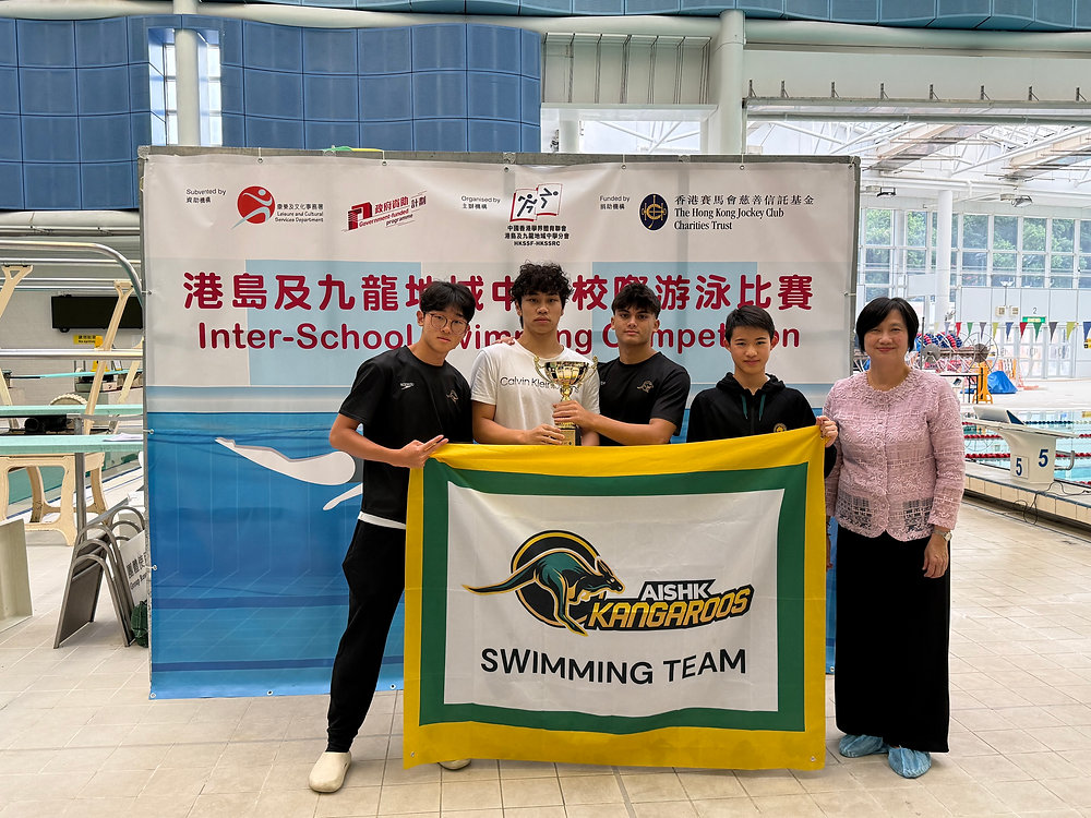 Swim Team Brings Home The Medals including Overall Champions Cup!