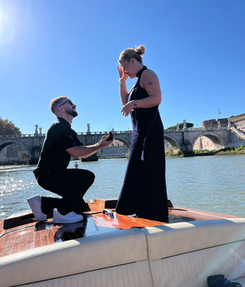 Rome marriage proposal on a private vintage boat at sunset on the Tiber