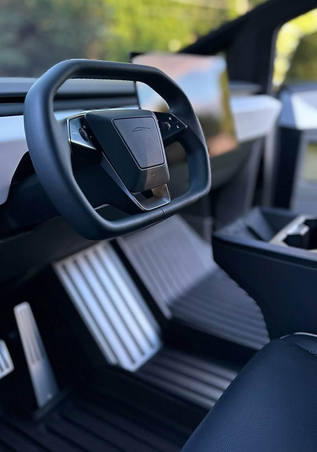 Close-up of a Tesla steering wheel after expert interior detailing in Lombard, IL.