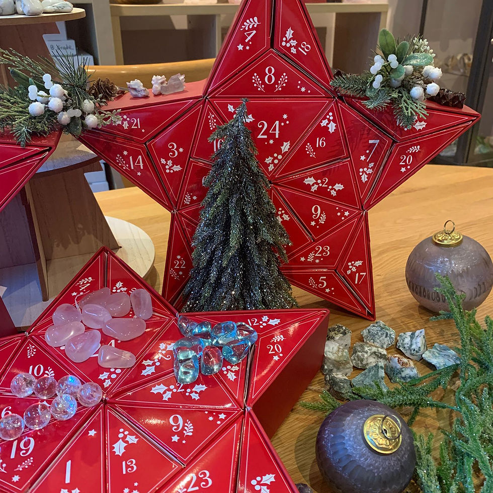 Red star-shaped advent calendars adorned with pine and crystals - Penny King Crystals