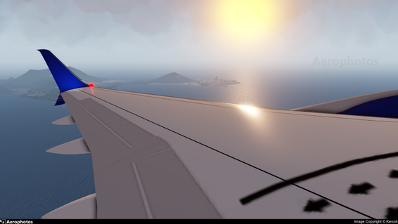 Left wing of an Oconian Kanamori K70 Departing RWY 05 from Oconee with a view of downtown Clarence t