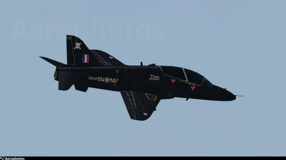 Hawk T1A of the RAF passing by a small city near the Mach Loop at Lionham AFB