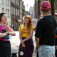 Sanne telling queer stories to guests during Amsterdam's queer city tour