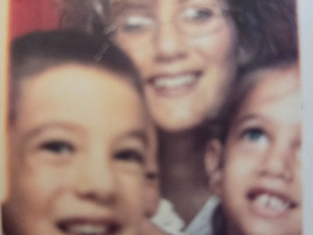 A photo booth memory - a moment of pure love with my three children.