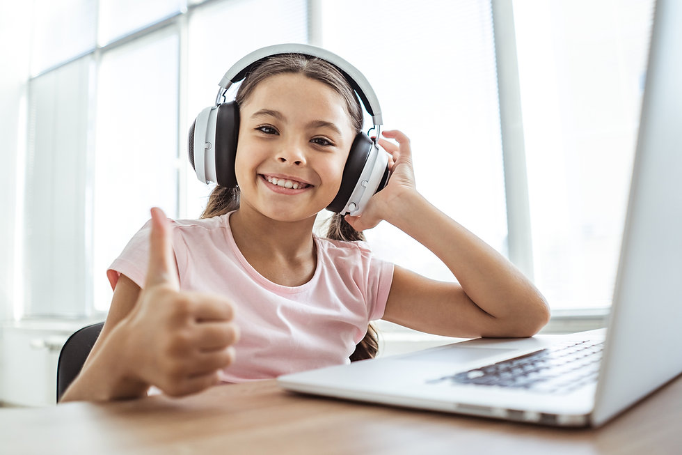 The-happy-girl-in-headphones-with-a-lapt