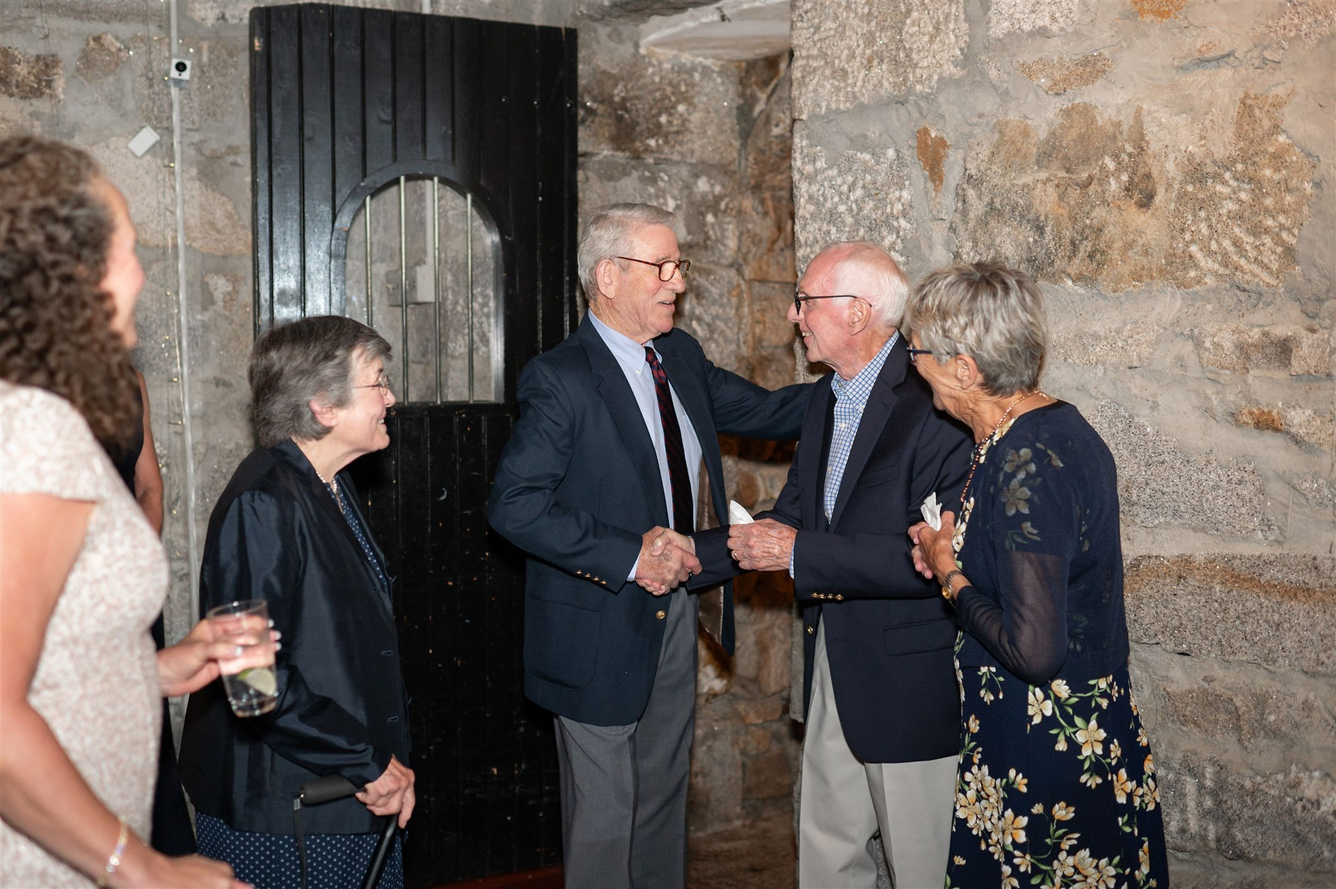 candid photos during rehearsal dinner in the cave at omni mount washington