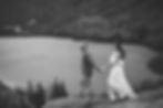 guy leading girl along mountainside in the white mountains during adventure elopement