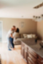 in home engagement session couple dancing in the kitchen