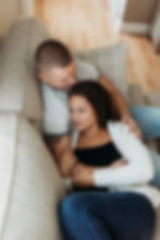 in home engagement session laying on couch view from above