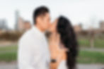 doug sahm hill downtown austin proposal. couple kisses while newly engaged bride shows the camera her left hand to show off her engagement ring. austin skyline in background.