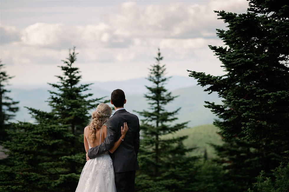 adventure elopement photo of couple looking out at view on mount greylock in the berkshires in western massachusetts