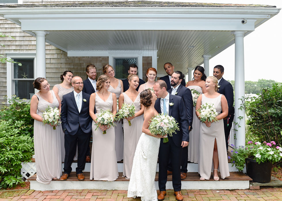 wedding party photo bride and groom kiss