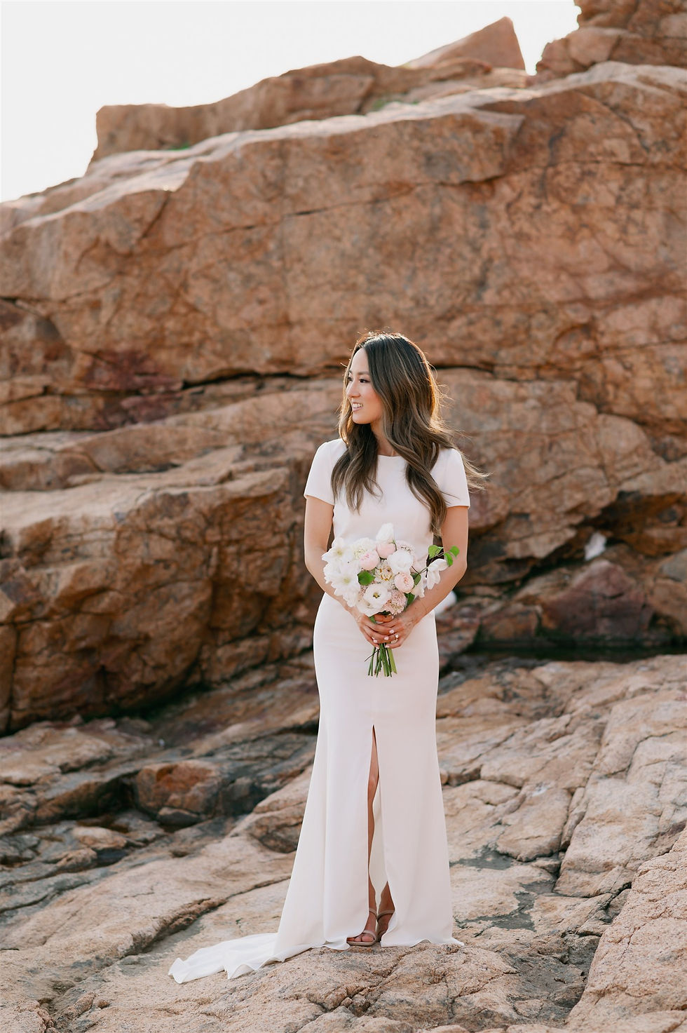bridal portrait during elopement with orange rocks