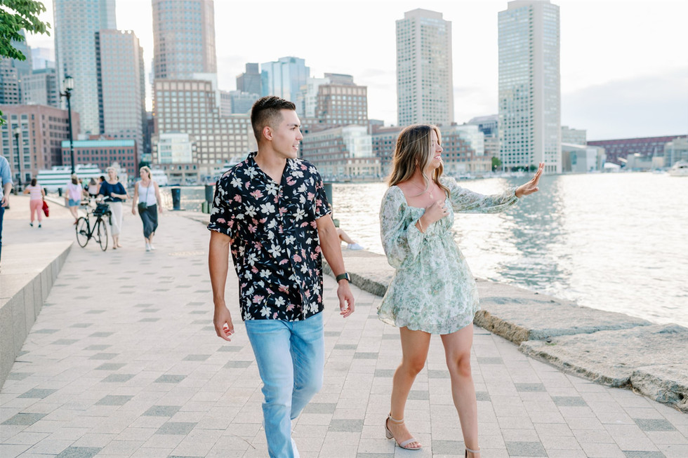 girl admiring engagement ring in boston seaport