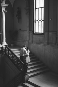 black and white moody photo on stairs at worcester city hall
