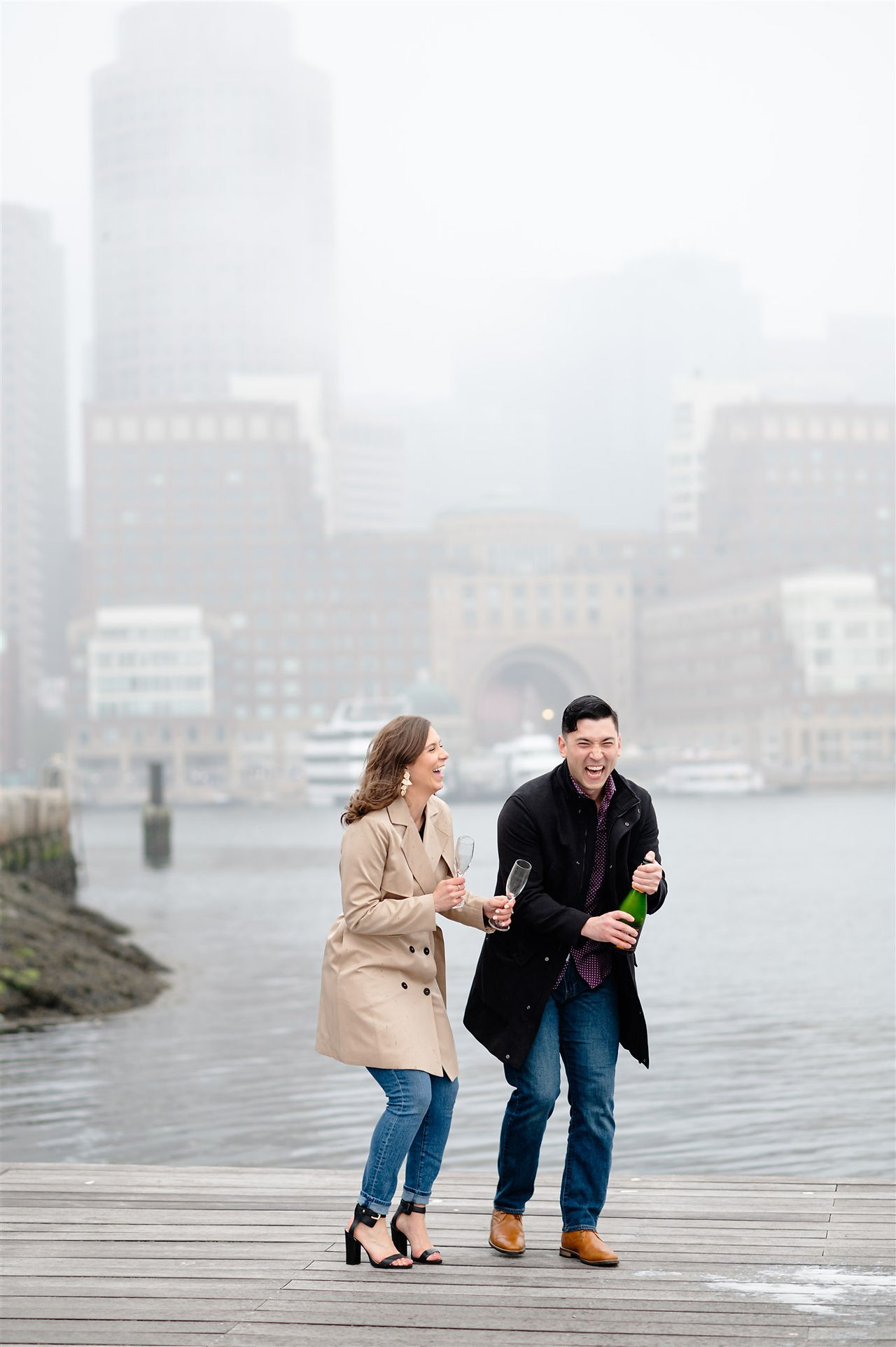 popping champagne on pier in Boston's Harborwalk