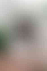 couple in romantic dip in front of inn on boltwood sign