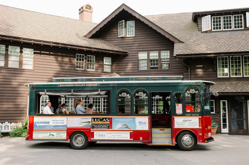 trolley bringing guests from ceremony to squam lake inn reception