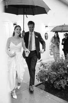 rainy candid wedding photo