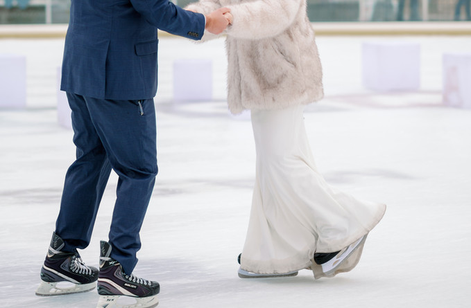 couple ice skating on worcester city hall oval rink
