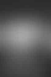 black and white photo of couple on grand staircase