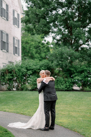 couple kissing in backyard of inn on boltwood