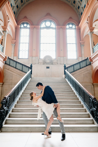 couple dip in front of grand staircase